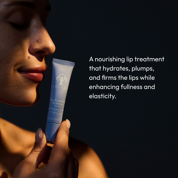 Woman holding a tube of Lip Renewing Hydrator - Naked | Circadia skincare product next to her face with soft lighting and text describing its hydrating and plumping benefits.