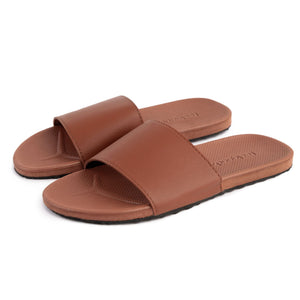 Brown open-toe slide sandals with textured footbed and wide strap, designed for comfort and casual wear, Spa/Shower Slide | Feelgoodz.