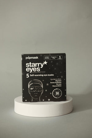 Black packaging of Starry Eyes Warming Eye Mask - Single | Popmask with white text and star graphics, highlighting five self-warming masks designed for skincare and wellness.