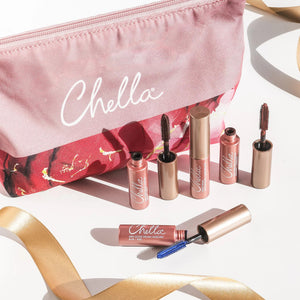 Drama & Shade Mini Mascara Set | Chella displayed alongside a pink and floral makeup bag with open mascara tubes featuring different brush types on a light background.