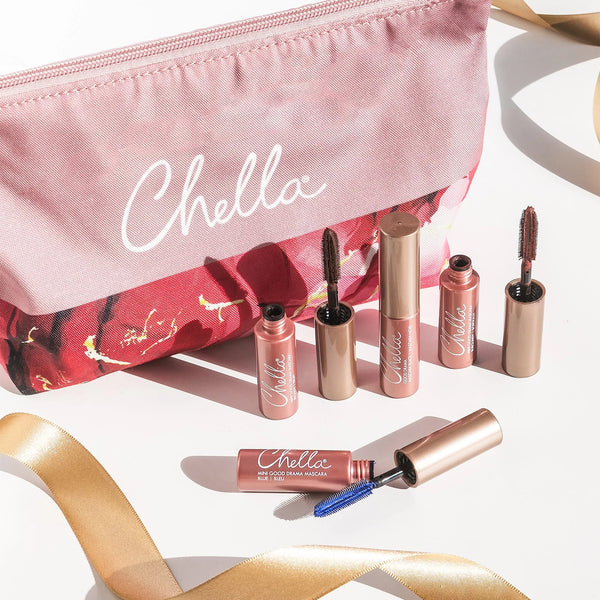 Drama & Shade Mini Mascara Set | Chella displayed alongside a pink and floral makeup bag with open mascara tubes featuring different brush types on a light background.