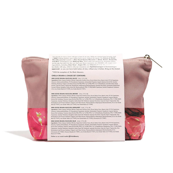 Back view of a pink floral makeup bag containing the Drama & Shade Mini Mascara Set | Chella with product ingredient details printed on the attached label.