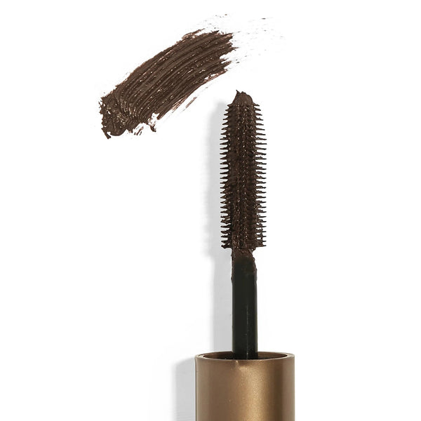 Close-up of a brown mascara wand with creamy mascara product and a brush stroke on a white background, representing the Drama & Shade Mini Mascara Set | Chella.