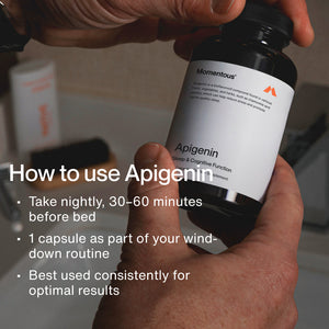 Person holding a bottle of Apigenin supplement with instructions on how to use, including taking one capsule 30-60 minutes before bed as part of a nightly routine for sleep and cognitive support.
