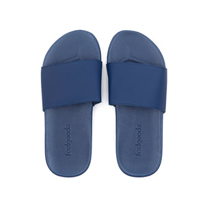 Pair of navy blue Spa/Shower Slide | Feelgoodz sandals with a textured footbed designed for comfortable wear during skincare and body care routines.
