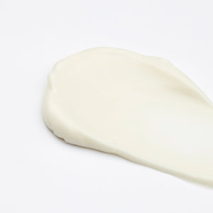 Dollop of Cyfolia Organic Radiance Cleansing Cream on white background
