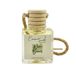 Square glass car diffuser bottle with a wooden cap and rope hanger, labeled "Wine Barrel," part of the Car Diffuser | CommonScents by Tayler E collection.