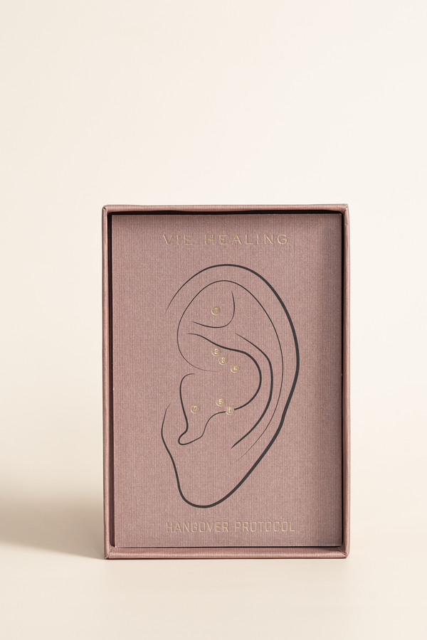 Packaging of Detox and Cleanse - 24K Gold Ear Seed | Vie Healing featuring a minimalist ear illustration with gold ear seeds targeted for wellness and recovery.