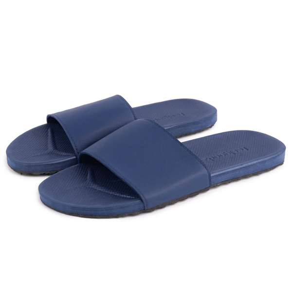 Pair of navy blue Spa/Shower Slide | Feelgoodz with textured footbed and wide strap, designed for comfortable wear during spa or shower routines.