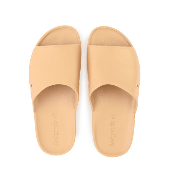 Top view of a pair of tan open-toe Bonsai Slides Tan | Feelgoodz with a smooth finish and comfortable footbed designed for casual wear.