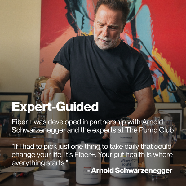 Arnold Schwarzenegger preparing a wellness supplement with containers on a table, promoting Fiber+ with a focus on gut health and expert guidance.