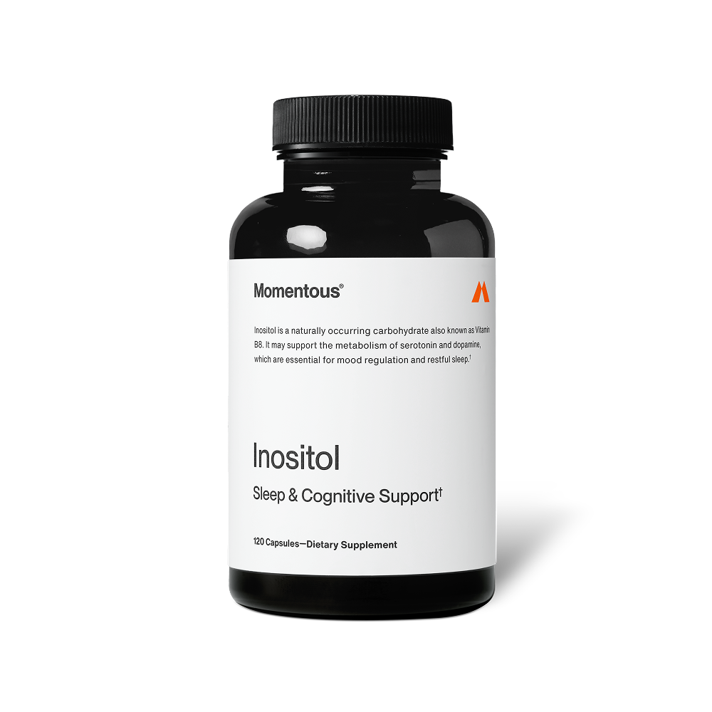 A black bottle of Inositol dietary supplement by Momentous featuring sleep and cognitive support, designed for wellness and mood regulation.