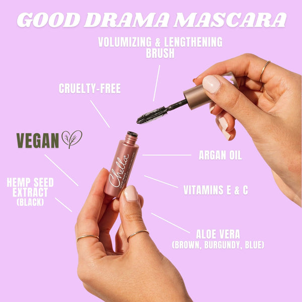 Close-up of hands holding a tube and wand of Drama & Shade Mini Mascara Set | Chella with text highlighting features like vegan, cruelty-free, argan oil, vitamins E and C, aloe vera, hemp seed extract, and a volumizing brush.