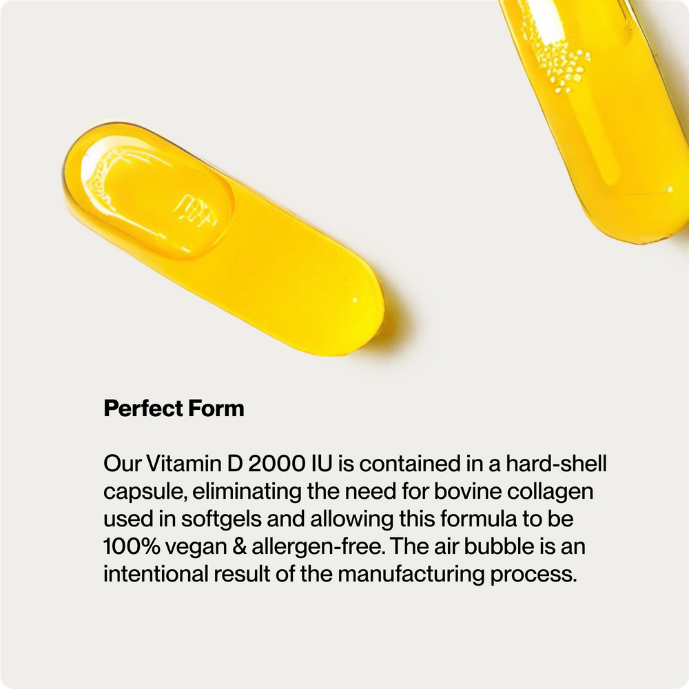 Bottle of Momentous Vitamin D3 2000 IU dietary supplement with 60 liquid capsules supporting skeletal, muscular, cardiovascular, and immune health for wellness supplements.