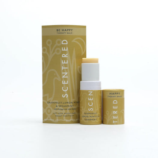 Be Happy Mini Aromatherapy Balm | Scentered in a yellow tube with matching box, featuring grapefruit, lemon myrtle, and spearmint for mood enhancing wellness and skincare.