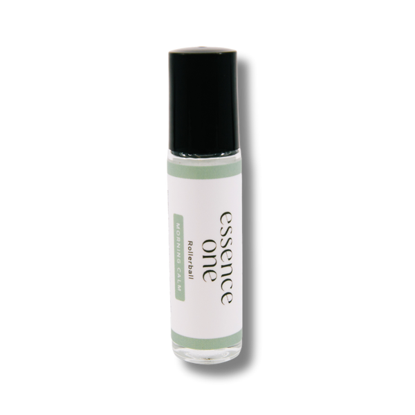 Clear glass rollerball bottle with a black cap labeled Morning Calm Rollerball - Anxiety Support | Essence One, designed for wellness and body care use.