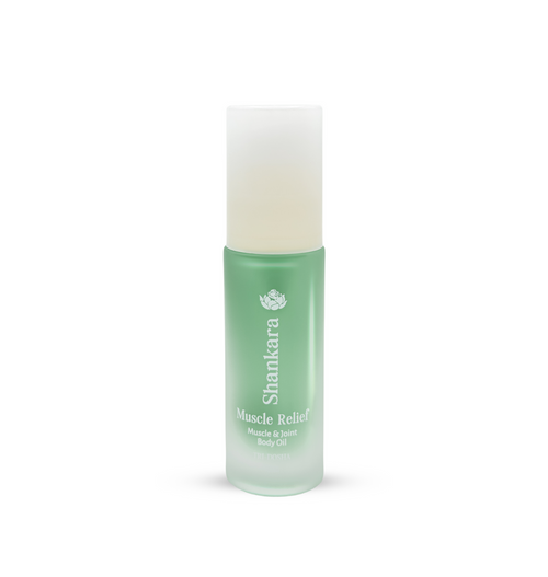 Green frosted glass bottle of Muscle Relief Oil | Shankara with a white cap, designed for muscle and joint body care and wellness.