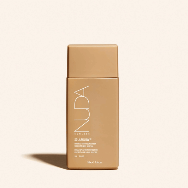Solarglow™ Mineral Serum Sunscreen | NUDA in a sleek, minimal beige bottle designed for skincare and sun protection with broad spectrum SPF 49.