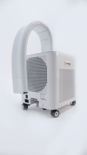 Compact white HomePlunge H3 Cold Plunge Chiller | HomePlunge unit with ventilation grilles, a curved handle, and caster wheels for easy mobility in a clean, minimal setting.