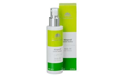 Bottle and packaging of Body Oil | Pino Spa Therapy with lime bamboo scent, featuring a green and white label, designed for skincare and body care routines.