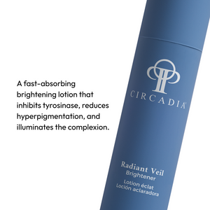 Close-up of a blue tube of Radiant Veil Brightener (formerly White Veil Brightener) | Circadia, a fast-absorbing skincare lotion that reduces hyperpigmentation and brightens the complexion.