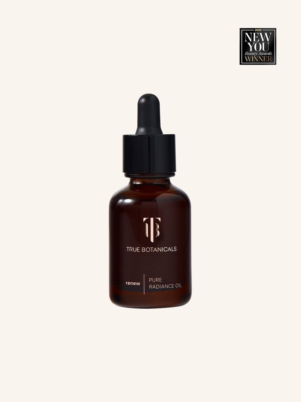 Bottle of Renew Pure Radiance Oil | True Botanicals with dropper cap in amber glass, awarded 2022 New You Beauty Awards Winner, shown against a plain light background.