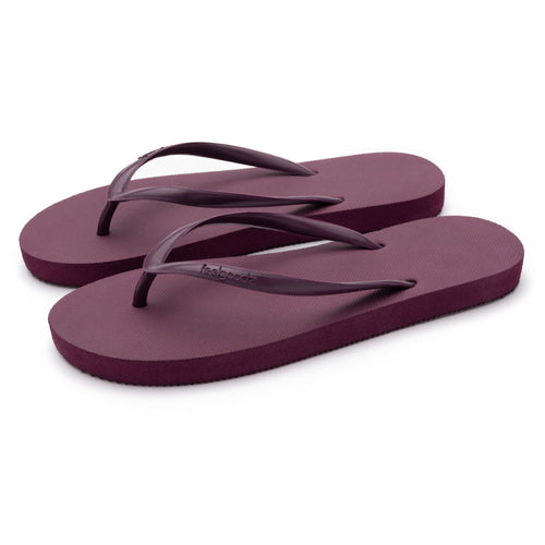 Pair of simple maroon flip-flop sandals with thin straps, designed for comfort and casual wear, featuring Slimz Core Sandals | Feelgoodz branding.