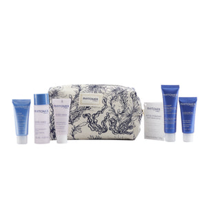 Seaside Moisturizing Starter Kit | Phytomer featuring six skincare products in blue and white packaging with a patterned toiletry bag, ideal for moisturizing and body care.