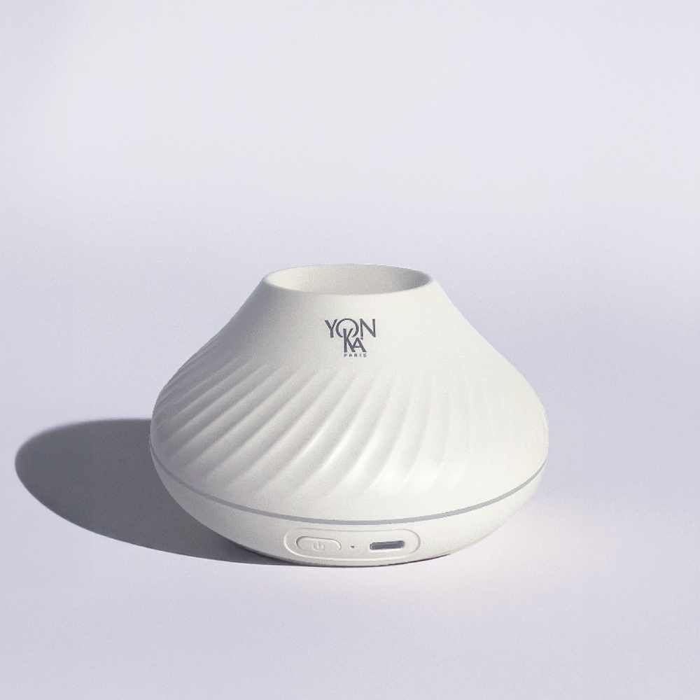 Sleek white sculpted diffuser with subtle spiral texture and Yon-Ka Paris logo, designed for wellness and skincare ambiance, named Quintessence Diffuser | YON-KA PARIS.