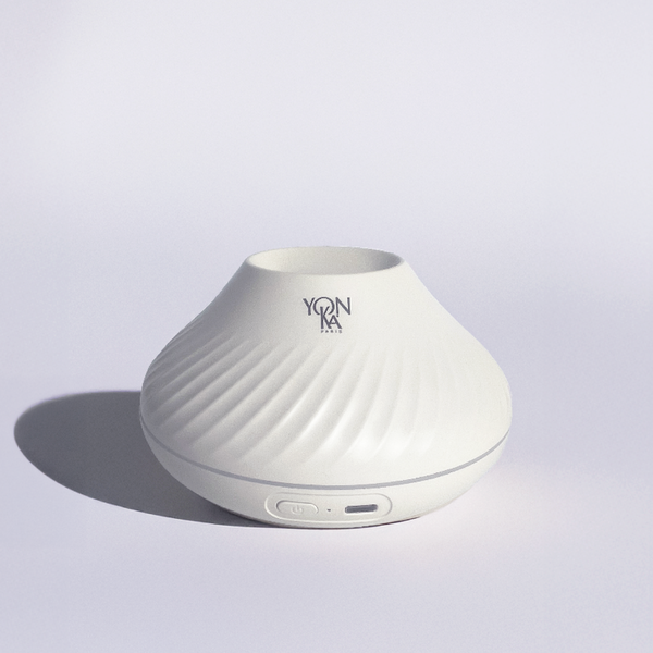 Sleek white sculpted diffuser with subtle spiral texture and Yon-Ka Paris logo, designed for wellness and skincare ambiance, named Quintessence Diffuser | YON-KA PARIS.