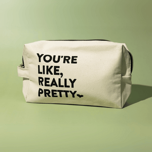 You're Like, Really Pretty Bag | Live Love Spa featuring a beige canvas pouch with bold black text on the front, ideal for storing skincare or wellness products.