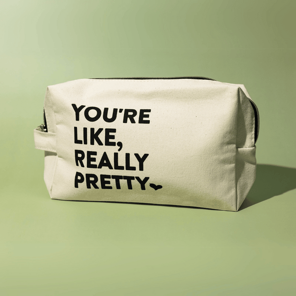 You're Like, Really Pretty Bag | Live Love Spa featuring a beige canvas pouch with bold black text on the front, ideal for storing skincare or wellness products.