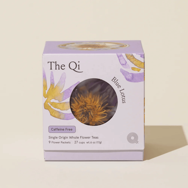 Box packaging of Blue Lotus Whole Flower Tea | The Qi featuring floral artwork, highlighting caffeine-free, single origin whole flower teas with 9 flower packets inside.