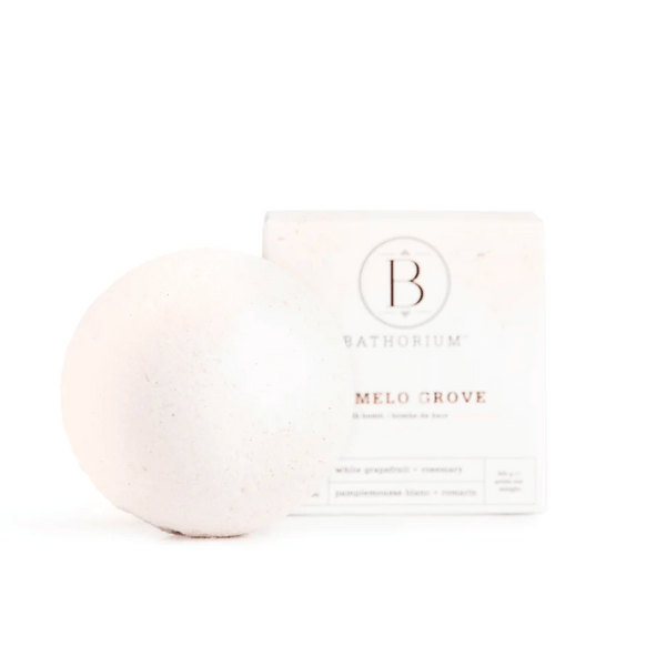Pomelo Grove Bath Bomb | Bathorium with a smooth white spherical bath bomb and its branded packaging, designed for skincare and wellness spa experiences.