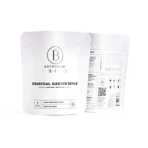 Charcoal Garden Detox Crush | Bathorium detoxifying bath soak in white resealable pouches, featuring creamy effervescent lather and epson salt base for skincare and body care wellness.