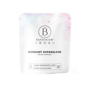 Packaging of Midnight Superbloom Crush | Bathorium, a mineral sea salt-based bath soak designed for creamy effervescent lather and wellness care.