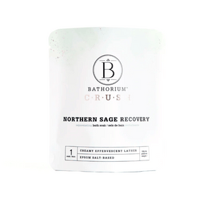 White resealable pouch of Northern Sage Recovery Crush | Bathorium, an Epsom salt-based bath soak for skincare and body recovery with creamy effervescent lather.