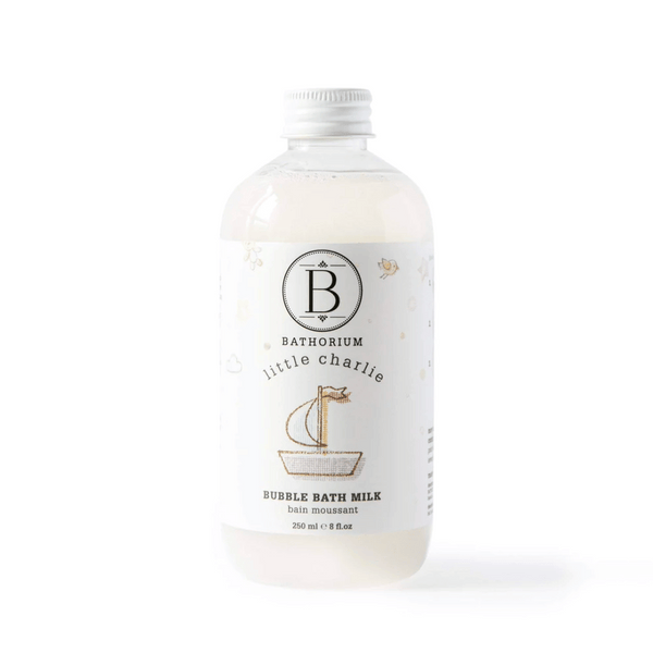 Clear bottle of little charlie™ Bubble Bath Milk | Bathorium with white cap and minimalistic label featuring a small sailboat illustration, designed for skincare and body care.