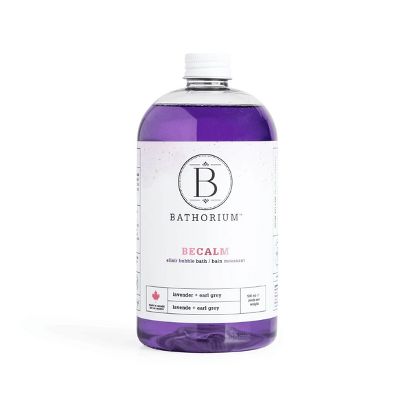 Clear bottle of BeCalm Bubble Elixir | Bathorium with purple lavender and earl grey bath elixir inside on a white background, promoting relaxation and wellness skincare.