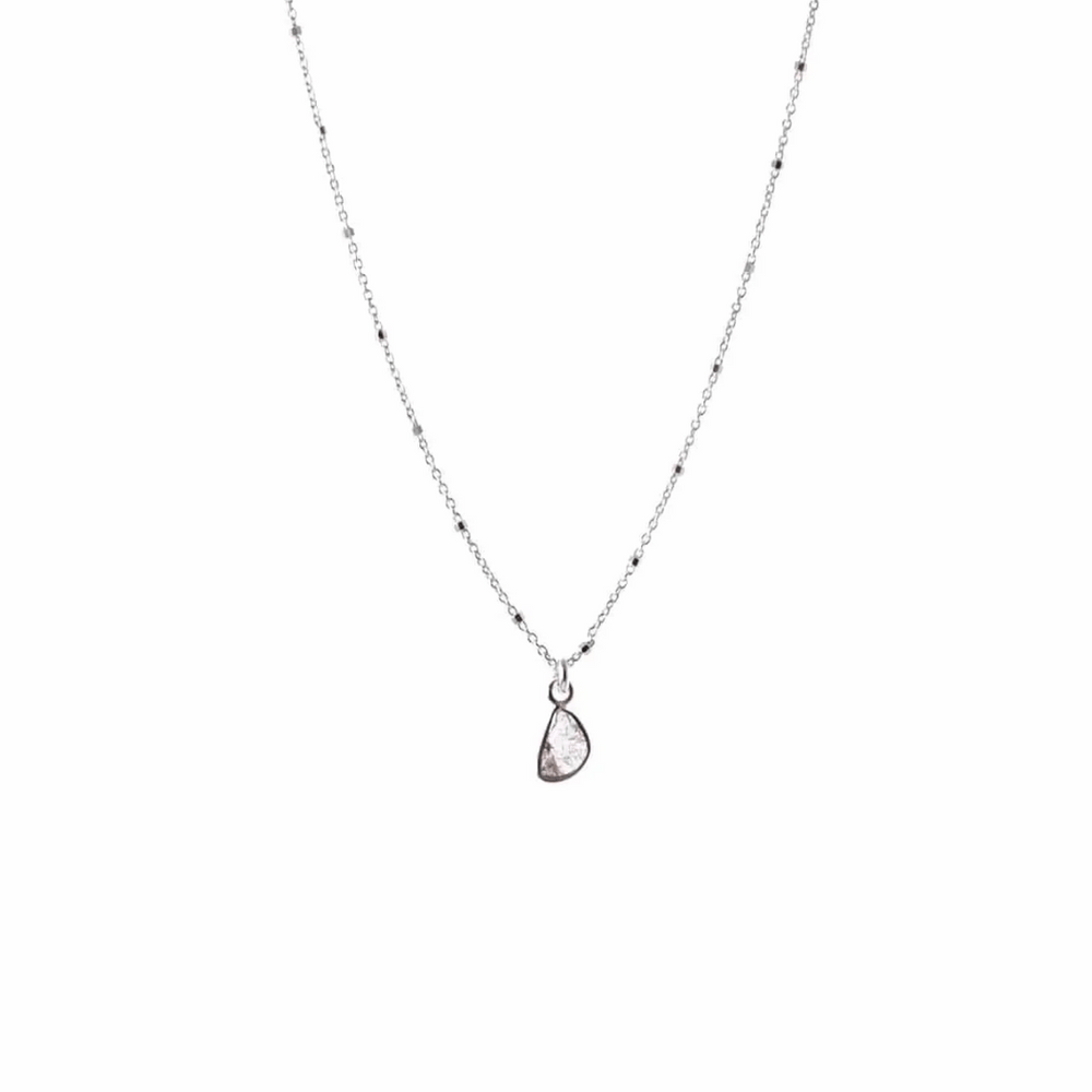 Diamond Slice Sterling Silver Necklace | Liv & B featuring a delicate sterling silver chain with a unique teardrop-shaped diamond slice pendant, perfect for elegant everyday wear.