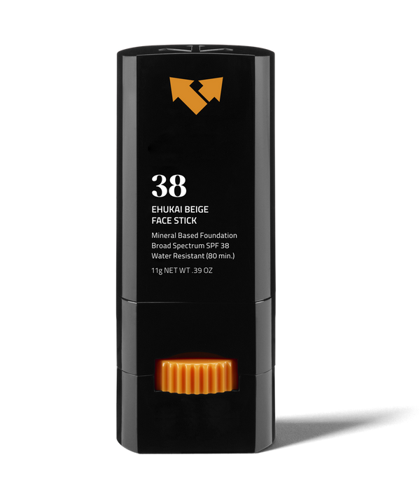 Ehukai Beige Sunscreen Face Stick SPF 38 | Vertra in a sleek black container with orange twist dial, mineral-based foundation offering broad spectrum SPF 38 protection for skincare.