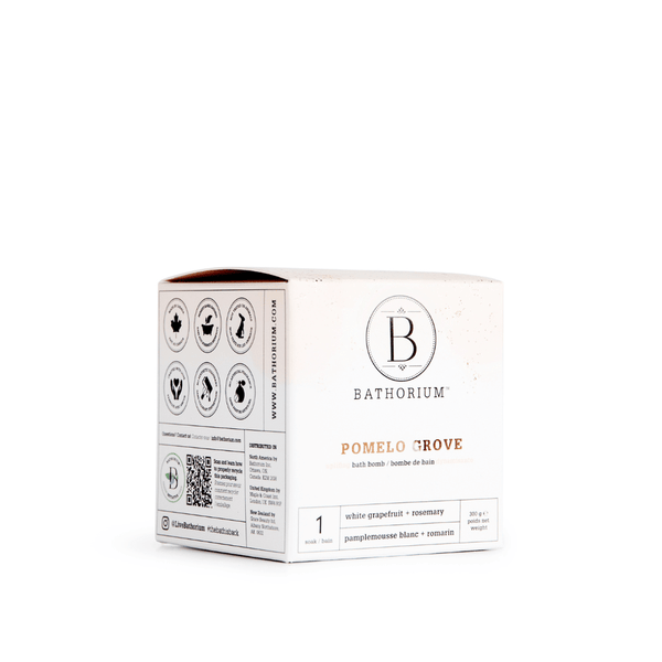 White and beige box packaging for Pomelo Grove Bath Bomb | Bathorium featuring natural skincare ingredients like white grapefruit and rosemary for a refreshing body care experience.