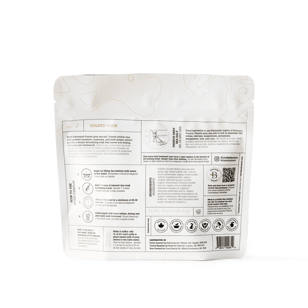 Back view of the "Golden Hour Clay Mineral Soak | Bathorium" package showing detailed usage instructions, product benefits, and wellness supplement information.