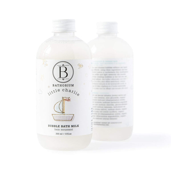 Clear plastic bottle of little charlie™ Bubble Bath Milk | Bathorium with white label featuring a simple boat illustration, designed for skincare and body care wellness.