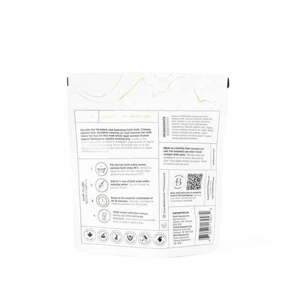 Back view of Coconut + Vanilla Milk Mineral Soak 650g | Bathorium packaging showing product instructions, ingredients, and wellness certifications for body care.