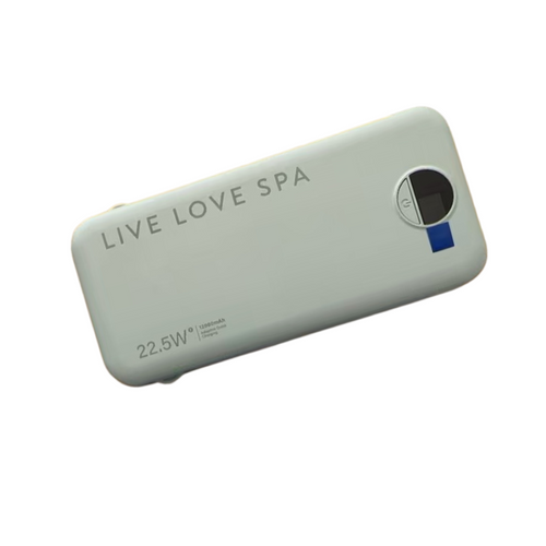 White compact Portable Charger Fast Charging Power Bank | Live Love Spa with digital display and 22.5W power capacity for on-the-go device charging.