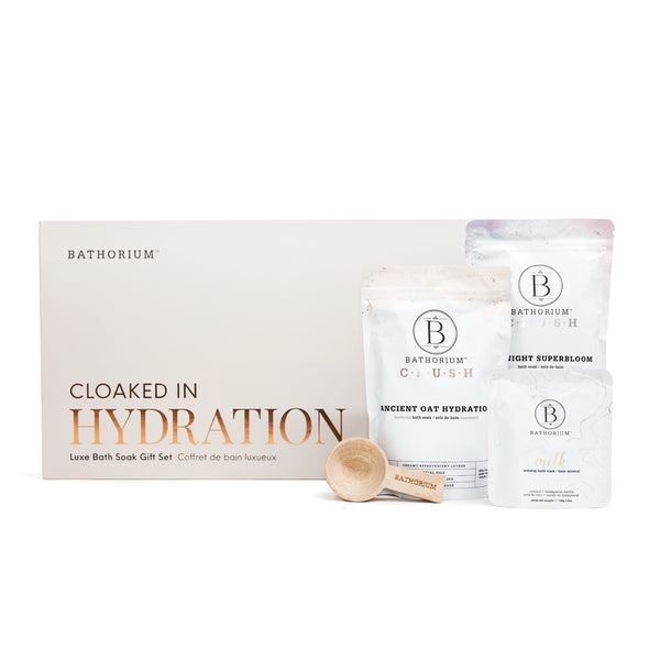 Cloaked In Hydration Gift Box Set | Bathorium featuring luxurious bath soak sachets and a wooden scoop for skincare and body care hydration and wellness.