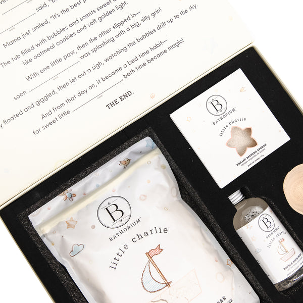 Gift box set featuring little charlie™ My First Bath Ritual Gift Box Set | Bathorium with bath soak, chewable bath bomb, and serene chew for a gentle, soothing bath experience.