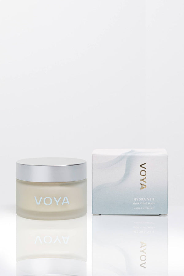Clear frosted glass jar with silver lid and matching box packaging for Hydraveil Hydrating Face Mask | VOYA, designed for skincare and wellness.