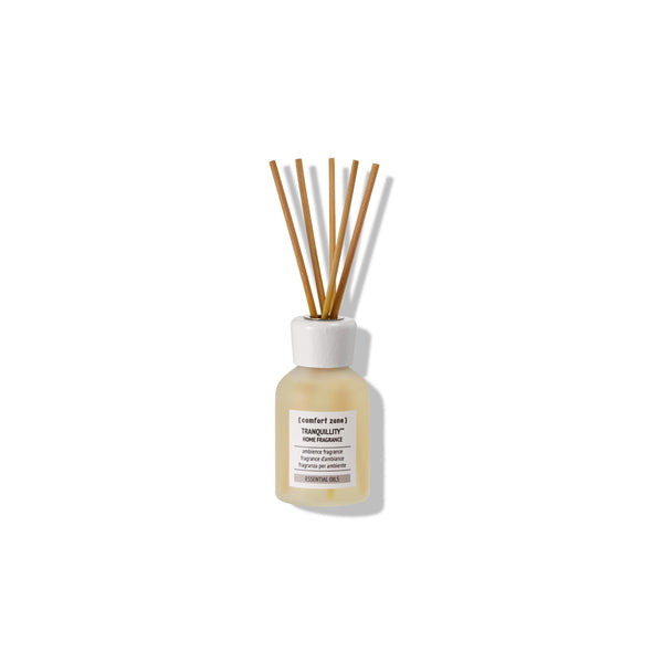 Glass diffuser bottle with wooden reeds containing Tranquillity Home Fragrance | [ comfort zone ] for calming wellness and a serene home atmosphere.